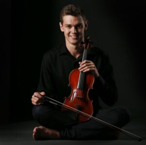 Blake sitting witht he violin